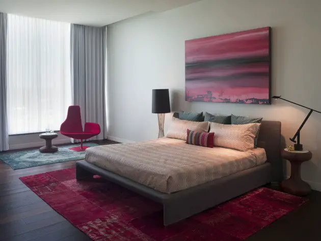 Modern bedroom with red rug