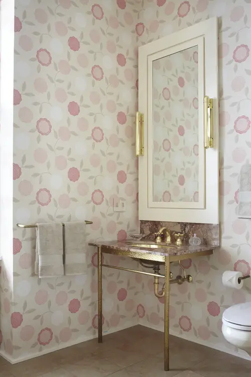 Pink bathroom walls and gold details